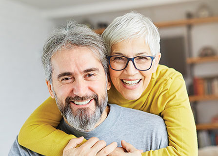 Photo of a couple smiling. Link to Life Stage Gift Planner Under Age 60 Situations.